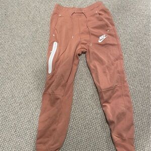 Nike Sportswear Tech Fleece Women's Mid-Rise Joggers in light pink